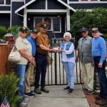 Carlsborg VFW Post 6787 representatives present a donation to the Captain Joseph House Foundation. Pictured, from left, are VFW representatives Denise Ashbran, Alan Morris and Commander Dave Yarnchak, Captain Joseph House founder Betsy Schultz, and VFW representatives Gary Vetie and Tom Cox. (Claire Rausch)