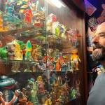 Corey Edwards, organizer of the Olympic Peninsula Toy and Collectibles Show, stands by his case of Kaiju monsters hes been collecting since the early 2000s. He said the show on Saturday will be an option for locals to find new and old toys that they might remember from their childhood. (Matthew Nash/Olympic Peninsula News Group)