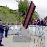 Rick McKenzie, a retired Coast Guard veteran, plays bagpipes at the 9/11 memorial at the Francis Street Park in Port Angeles on Wednesday. (Keith Thorpe/Peninsula Daily News)