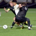 KEITH THORPE/PENINSULA DAILY NEWS Peninsulas Koya Kimura, center, breaks through the defense of Everetts Noah Harrison-Russell, left, and Dilon Spahia on Wednesday in Port Angeles.