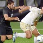 KEITH THORPE/PENINSULA DAILY NEWS
Peninsula's Konrad Mueller left, pushes off against Everett's Cristiano Whitaker on Wednesday at Peninsula College.