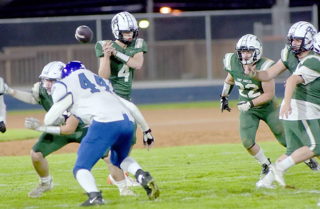 KEITH THORPE/PENINSULA DAILY NEWS
Port Angeles quarterback Blake Sohlberg has the snap get away from him during Friday's game against North Mason at Port Angeles Civic Field.