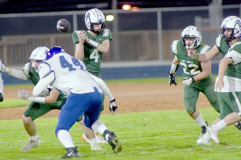 KEITH THORPE/PENINSULA DAILY NEWS
Port Angeles quarterback Blake Sohlberg has the snap get away from him during Friday's game against North Mason at Port Angeles Civic Field.