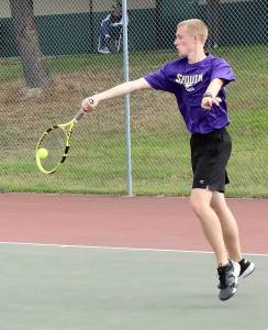 Photos by Dave Logan/for Peninsula Daily News
Sequims No. 1 singles player Jack Crecelius returns a volley against Port Angeles Tate Alton.