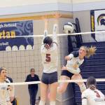 Spartan Keana Rowley gets the hit against Hoquiam's Hayden Brook-Andrew Tuesday night in Forks where Forks outlasted the Grizzlies winning 3 to 2 in all close sets.  Also in the action are Forks' Erika Williams (1) and Hoquiams's Katlyn Brodhead (3). Photo by Lonnie Archibald.