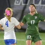 KEITH THORPE/PENINSULA DAILY NEWS
Port Angeles' Ava-Anne Sheahan, right, takes the header as Bremerton's Melanie Uhrich closes in on Tuesday night in Port Angeles.