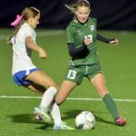 KEITH THORPE/PENINSULA DAILY NEWS Port Angeles Brook Pierce, right, fends off Bremertons Harlow Moffet during Tuesdays match at Peninsula College.
