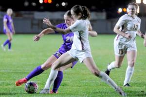 Sequim's Sasha Yada (20) battles for a ball against a Kingston player on Tuesday in Sequim. Kingston won the match 3-2 in penalty kicks. (Michael Dashiell/Olympic Peninsula News Group)