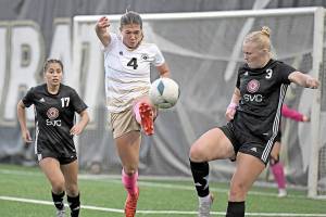 Jay Cline/for Peninsula College Athletics
Peninsula's Shawna Larson, center, concentrates on the ball in front of Skagit Valley's Paige Mason, right, a 2024 Port Angeles High School graduate, and Stephanie Ortiz during the Pirates' 4-1 win Wednesday at Wally Sigmar Field.