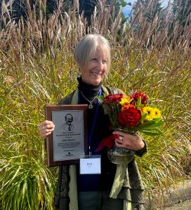 Barbara Wise displays the Washington Newspaper Publisher Associations Miles Turnbull Master Editor/Publisher award honoring her late husband John Brewer at the WNPA convention in Olympia on Oct. 5. (photo by Ileana Murphy Haggerty)