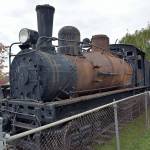 The Rayonier locomotive, known as the 4, located at the corner of Chase Street and Lauridsen Boulevard in Port Angeles, awaits restoration as a fundraising drive to renovate the engine and make improvements to the traffic triangle where the train is on display. (Keith Thorpe/Peninsula Daily News)