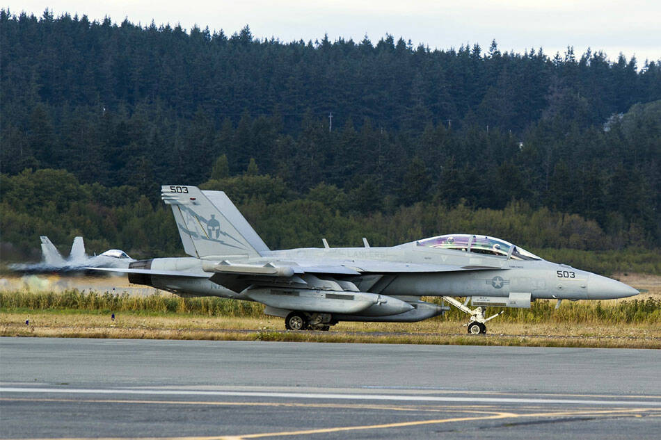 An EA-18G Growler taxis down the airstrip on Naval Air Station Whidbey Island during the squadrons welcome home ceremony in August 2017. (Mass Communication Specialist 2nd Class Scott Wood/U.S. Navy)