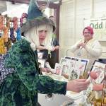 Karyn Bocko of Port Angeles, front, looks at mushroom merchandise at the annual Fungi Festival on Saturday at the Clallam County Fairgrounds. Looking on at right is Freya Gereke of Portland-based Odd Fox & Fern. The two-day event brought together mushroom fans for a weekend of fungus appreciation, along with food, merchandise and workshops. (Keith Thorpe/Peninsula Daily News)
