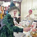 Karyn Bocko of Port Angeles, front, looks at mushroom merchandise at the annual Fungi Festival on Saturday at the Clallam County Fairgrounds. Looking on at right is Freya Gereke of Portland-based Odd Fox & Fern. The two-day event brought together mushroom fans for a weekend of fungus appreciation, along with food, merchandise and workshops. (Keith Thorpe/Peninsula Daily News)