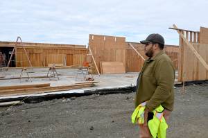 Noah Glaude, North Olympic Library Systems executive director, looks over recent construction at the site of the Sequim Librarys expansion. (Michael Dashiell/Olympic Peninsula News Group)