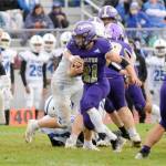 Sequims Aron Golbeck (21) looks for yardage against Olympic in a delayed game Saturday. The Wolves were able to move the ball on Olympic but mistakes hurt them in a 28-7 loss. (Matthew Nash/Olympic Peninsula News Group)