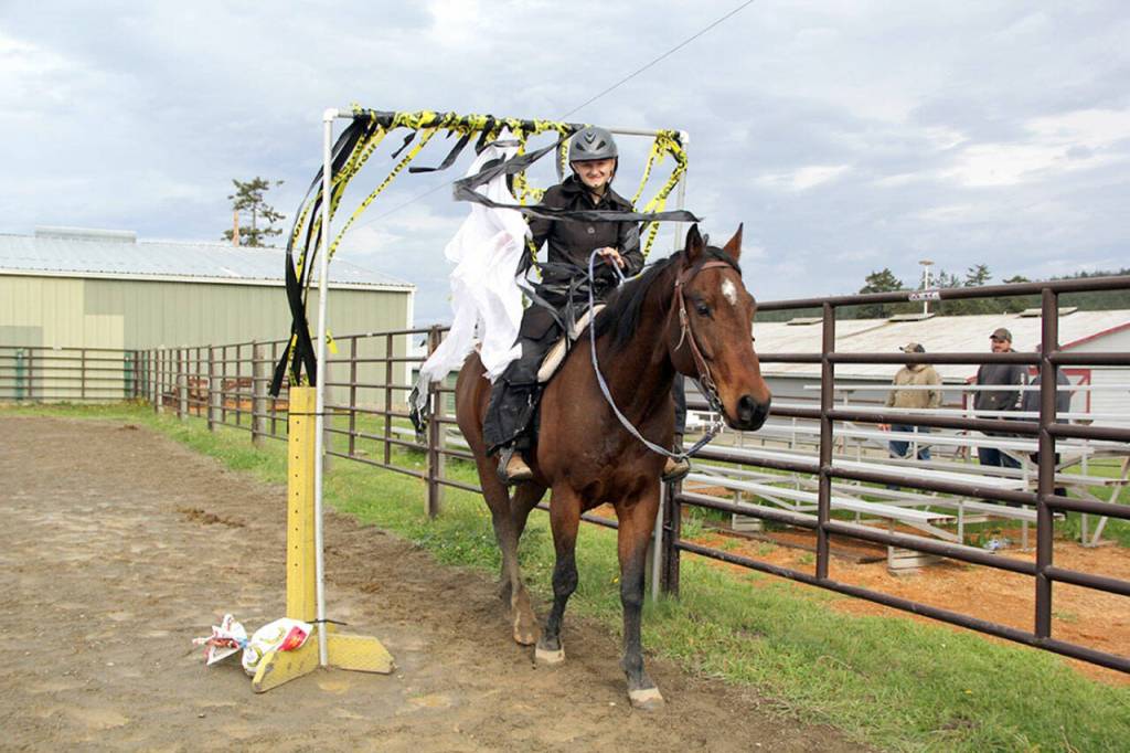 Photo by Karen Griffiths
Lyla Fransons horse Jackson didnt hesitate to walk through the windblown plastic ribbons, and a flapping white sheet that most horses would have found too scary to walk through. Just one of several obstacles set up last Sunday by JC Horse Project leaders.