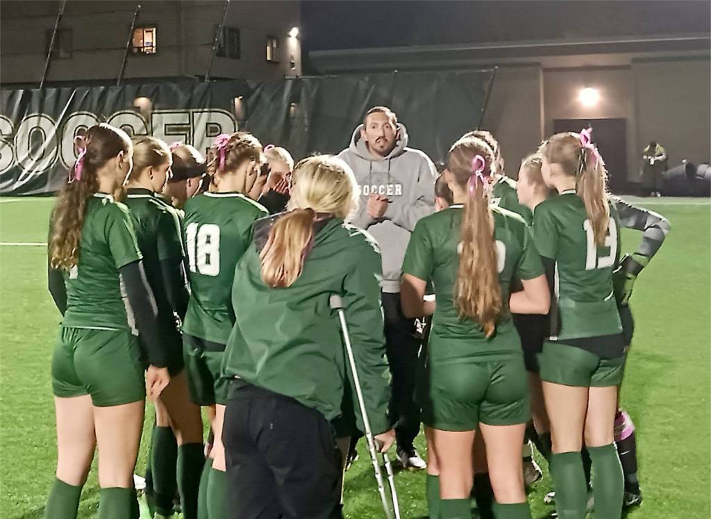 Photos by Pierre LaBossiere/Peninsula Daily News
Port Angeles head girls soccer coach Daniel Horton talks with his team before beginning its rivalry match Tuesday night against Sequim at Wally Sigmar Field at Peninsula College.