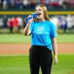 Boys & Girls Clubs Youth Performer Pearle Peterson of Sequim sings the national anthem prior to Game 2 of the 2023 World Series between the Arizona Diamondbacks and the Texas Rangers on Oct. 28 in Arlington, Texas. She will sing it again at the World Series in Los Angeles on Saturday. (Mary DeCicco/MLB Photos via Getty Images)