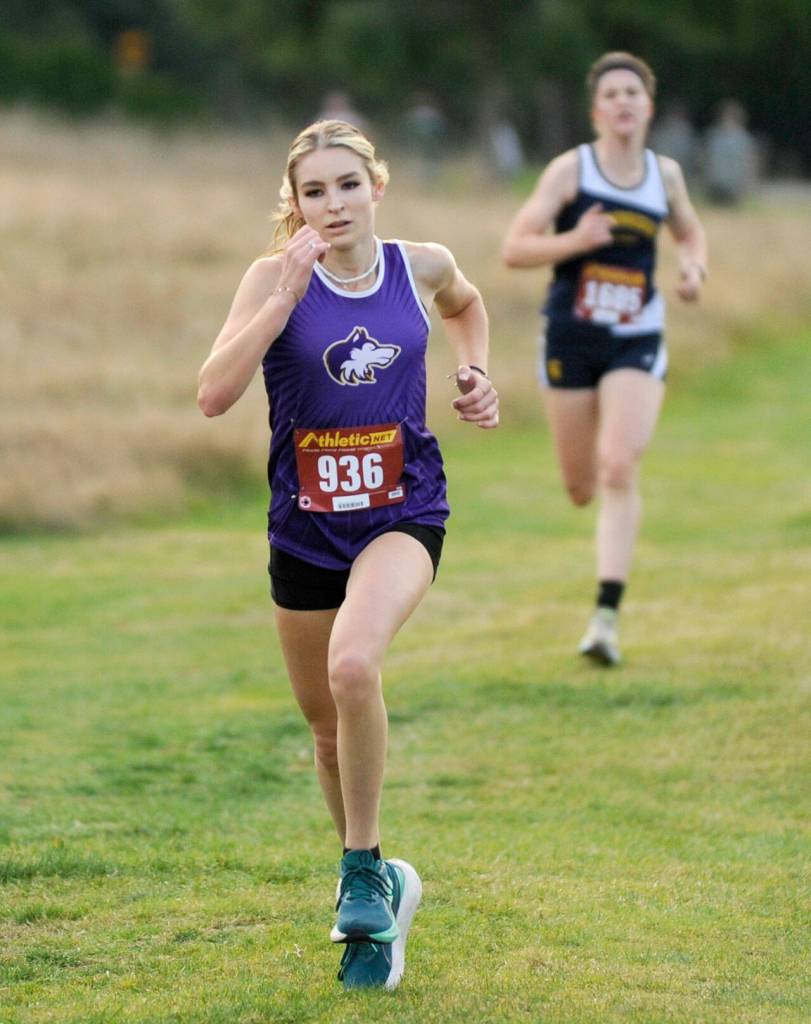 Michael Dashiell/Olympic Peninsula News Group Sequims Dawn Hulstedt, front, finished fourth at the Olympic League Cross Country Championships held Thursday at The Cedars at Dungeness Golf Course.