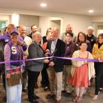 Wendy Sisk, CEO for Peninsula Behavioral Health, and Clallam County commissioner Randy Johnson cut a ribbon with the Sequim-Dungeness Valley Chamber of Commerce on Oct. 16 for PBHs first transitional house in Sequim. County funds helped pay for the refurbished home for five adults. (Peninsula Behavioral Health)