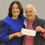 Marylaura Ramponi donates a $500,000 check on Oct. 17 to Sequim School District superintendent Regan Nickels for the Ramponi Center for Technical Excellence, a vocational building at Sequim High School. The check was made in honor of Marylauras husband Louie, as it would have been his 89th birthday. (Matthew Nash/Olympic Peninsula News Group)