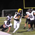 Forks Noah Foster runs down the sideline against Raymond-South Bend at Spartan Stadium on Friday night. Forks won 35-8. (Lonnie Archibald/for Peninsula Daily News)