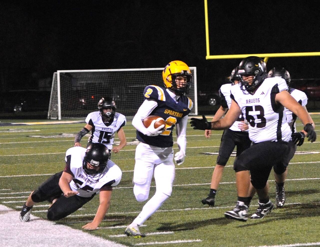 Forks Noah Foster runs down the sideline against Raymond-South Bend at Spartan Stadium on Friday night. Forks won 35-8. (Lonnie Archibald/for Peninsula Daily News)