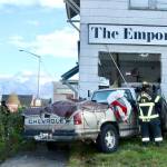 There were no serious injuries after a two-car collision pushed a Chevrolet pickup truck into the corner of the Emporium building at the corner of Eighth and Cherry streets in Port Angeles. (Dave Logan/for Peninsula Daily News)