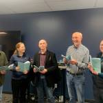 Cast members, from left, Stephen Browning, Christie Lang, Glenn Gilbert, Jim Gormly and Kelly McNees rehearse for the Port Ludlow Players production of Its a Wonderful Life: A Live Radio Play.