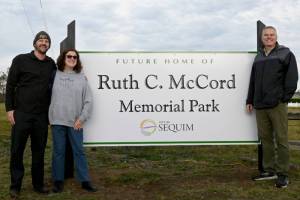 Family members of Ruth McCord celebrate the dedication of a park named after their mothers legacy on Oct. 25. The future park, located near North Seventh Avenue and West Hendrickson Road, looks to honor the late Sequim residents wishes to offer a place for youngsters and the elderly alike. (Michael Dashiell/Olympic Peninsula News Group)
