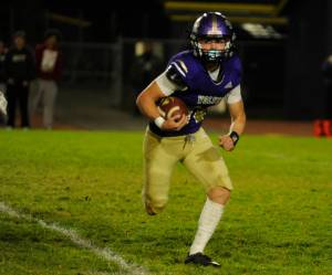 Sequim quarterback Zeke Schmadeke ran for 230 yards in the Wolves playoff-clinching win over North Mason on Thursday. Schmadeke is shown during an Oct. 25 home game with Bainbridge.
Michael Dashiell/Olympic News Group