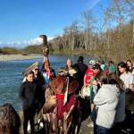 Lower Elwha Klallam Tribe members gather by the Elwha River to hold a ceremony in support of a petition to protect forests in the Elwha River Watershed. (John Gussman)