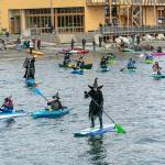 About two dozen witches set off on the second annual Witches Paddle from Northwest Maritime to the Pourhouse pub on Saturday, a distance of half a mile. (Steve Mullensky/for Peninsula Daily News)