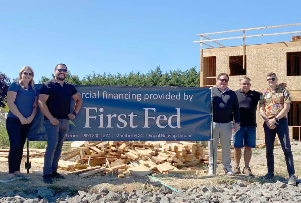 Kasi OLeary (First Fed Commercial Market Leader), Andy Hines (Owner Hines Homes), Matt Deines (CEO First Fed), Tony Cortani (Owner Tims Custom Cabinets), and John Textor (First Fed Treasury Management Officer) at the Melody Lane construction site. Courtesy First Fed