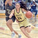 Peninsulas Shania Moananu, right, drives past Shorelines Mailana Mattos during a February 2024 contest at Peninsula College.