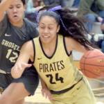 KEITH THORPE/PENINSULA DAILY NEWS Peninsulas Shania Moananu, right, drives past Shorelines Mailana Mattos on Wednesday night in Port Angeles.