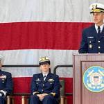 Rear Admiral Charles E. Fosse, right, U.S. Coast Guard District 13 commander, was the guest speaker at the U.S. Coast Guard Station Port Angeles annual Veterans Day celebration on Monday. Chaplain Mike VanProyen, left, and Kelly Higgins, the commanding officer at Coast Guard Air Station Port Angeles, also participated in the ceremony. (Paula Hunt/Peninsula Daily News)
