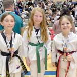 White Crane Martial Arts Inka Burke, Zae Kasten and Maisie Chistison all won medals this weekend at the Washington State Taekwondo Masters Union Presidents Cup tournament in Federal Way. (White Crane Martial Arts)