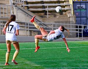 Peninsulas Shawna Larson attempts a bicycle kick during the first half of the Pirates NWAC semifinal win over Spokane. Larson, the NWACs leading scorer, had an assist in the teams victory.