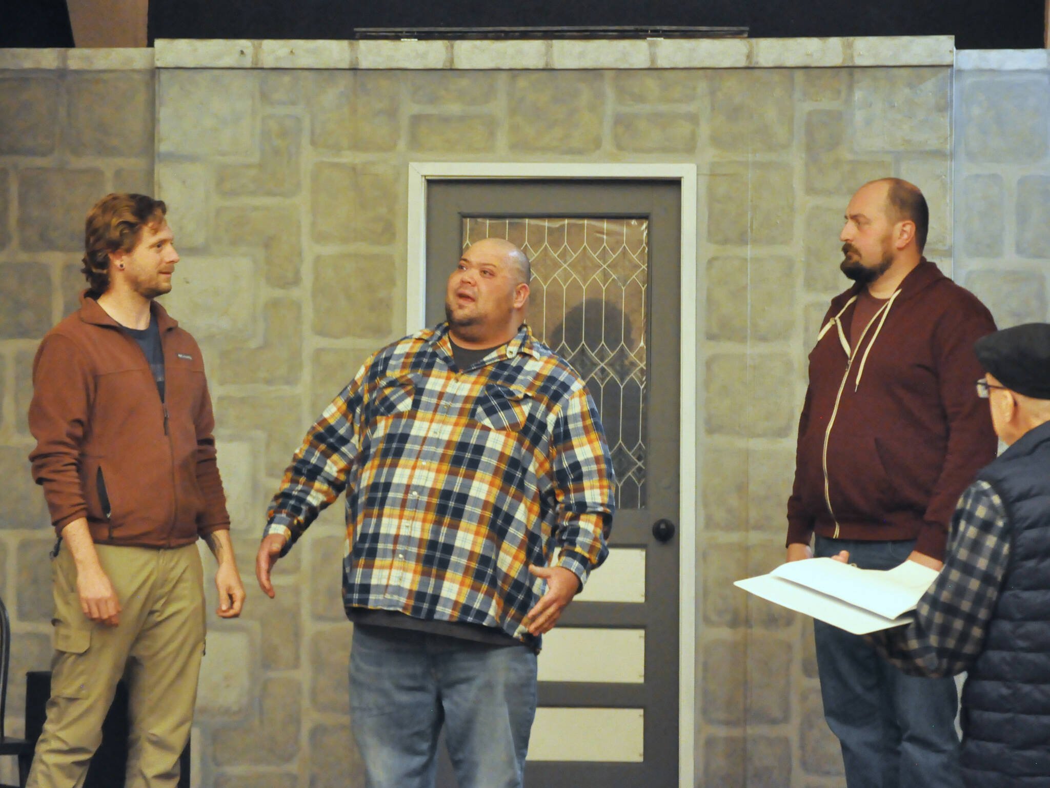 Actors, from left, Justin Stapleton, Mario Arruda and Sean Stone rehearse Artificial Emotions, a short play written by John Painter and directed by Bill Stone, far right. It will be the first of eight plays in Olympic Theatre Arts New Works Showcase through Sunday. (Matthew Nash/Olympic Peninsula News Group)