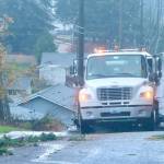 A street sweeper on I Street in Port Angeles cleans up the street along the curbs of all the debris that blew down during Tuesday evenings storm. Thousands were without power at the peak of the storm. (Dave Logan/for Peninsula Daily News)
