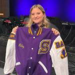Sequim High School junior Riley Campbell received a Letterman jacket on Nov. 9 for her years of service, volunteering with the Sequim Wolf Pack youth football and cheer program. (Sarah Campbell)