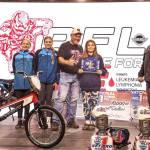 From left, Lincoln Park BMX's Teyah Elofson-Cross, Kylin Weitz, track operator Sean Coleman and Chloe Holloway represented the Olympic Peninsula at the BMX Grand Nationals last weekend in Tulsa, Okla. At right is USABMX president BA Anderson. Wietz won a first-place medal at Grand Nationals. (Lincoln Park BMX)