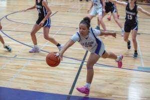 Emily Matthiessen/Olympic Peninsula News Group 
Sequims Bobbi Mixon attempts to save the ball from going out of bounds during the Wolves season-opening 50-30 loss to Anacortes on Wednesday.