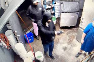 Surveillance footage released by the Clallam County Sheriffs Office shows a suspect allegedly holding a Frugals employee at gunpoint on Thursday. (Clallam County Sheriffs Office)