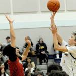 Lonnie Archibald/for Peninsula Daily News
Forks' Kyle Lohrengel scores over Hoquiam's Chance LaBounty during a 2023-24 contest in the Spartans gym. Lohrengel returns to play point guard for Forks.
