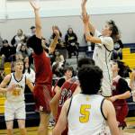 Lonnie Archibald/for Peninsula Daily News Forks Kyle Lohrengel scores over Hoquiams Chance LaBounty during a 2023-24 contest in the Spartans gym. Lohrengel returns to play point guard for Forks.