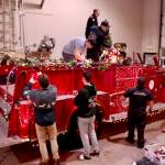 Santa’s elves, better known as the Port Angeles Fire Department, decorate their vintage 1956 Seagrave fire engine to get ready for the six-day Operation Candy Cane. This will be the 39th annual trek through the streets of Port Angeles to collect donations for area food banks. (Dave Logan/for Peninsula Daily News)