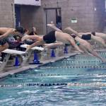Dave Logan (2)/for Peninsula Daily News 
Port Angeles (green caps) and Klahowya swimmers dive into the pool at Shore Aquatic Center for the 200-yard freestyle. The Roughriders won the season-opening Olympic League boys swim meet 147-30 over the Eagles.